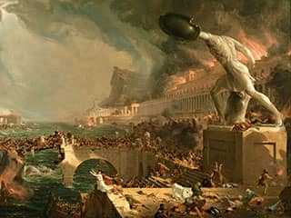 A statue of a headless warrior towers over a city on fire, some of its structures damaged and its residents in havoc.
