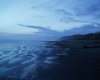 Ocean waves breaking on a beach.